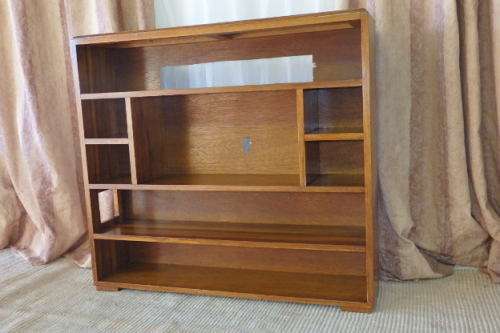 A BEAUTIFUL AND SOLIDLY MADE ORIENTAL TEAK BOOK CASE WITH AMPLE SHELVES AND STORAGE PIGEON HOLES