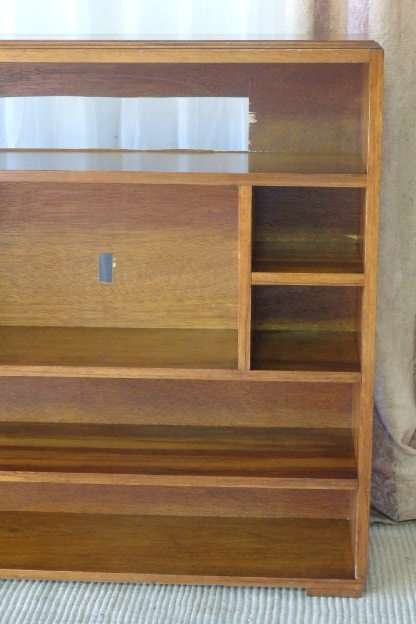 A BEAUTIFUL AND SOLIDLY MADE ORIENTAL TEAK BOOK CASE WITH AMPLE SHELVES AND STORAGE PIGEON HOLES