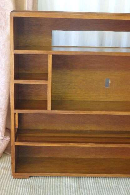 A BEAUTIFUL AND SOLIDLY MADE ORIENTAL TEAK BOOK CASE WITH AMPLE SHELVES AND STORAGE PIGEON HOLES