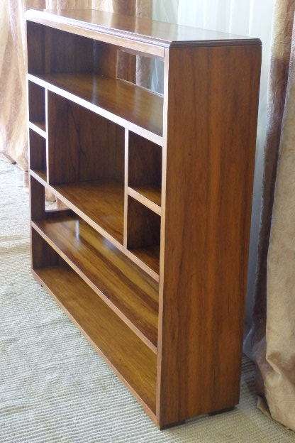 A BEAUTIFUL AND SOLIDLY MADE ORIENTAL TEAK BOOK CASE WITH AMPLE SHELVES AND STORAGE PIGEON HOLES