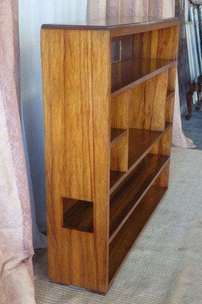 A BEAUTIFUL AND SOLIDLY MADE ORIENTAL TEAK BOOK CASE WITH AMPLE SHELVES AND STORAGE PIGEON HOLES