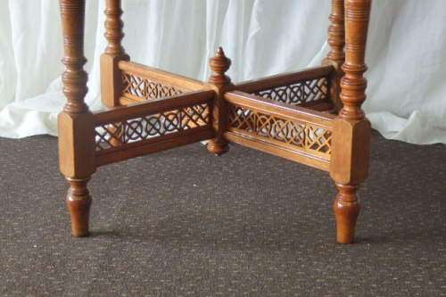 A BEAUTIFUL ANTIQUE ORIENTAL ELM WOOD OCCASIONAL TABLE w/ TURNED LEGS AND BEAUTIFUL CUT-OUT SUPPORTS