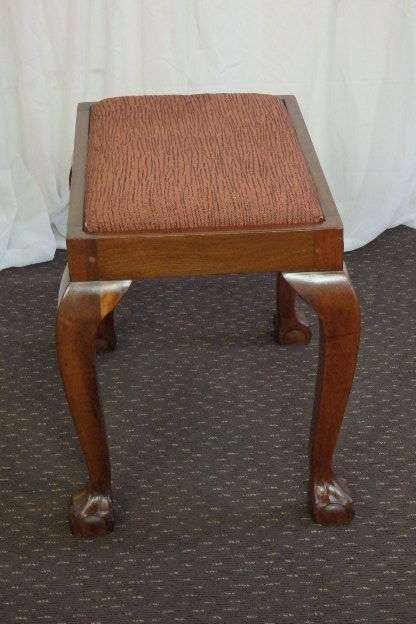 A BEAUTIFUL AND VERY WELL MADE ANTIQUE SOLID IMBUIA BALL AND CLAW DRESSING TABLE STOOL
