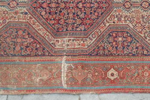 A MAGNIFICENT ANTIQUE PERSIAN CARPET (2.1m x 1.3m) WITH LOADS OF CHARACTER AND CHARM
