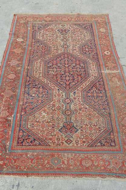 A MAGNIFICENT ANTIQUE PERSIAN CARPET (2.1m x 1.3m) WITH LOADS OF CHARACTER AND CHARM
