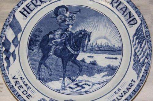 AN EXTREMELY RARE SOCIETE CERAMIQUE MAASTRICHT "HERRIJZEND NEDERLAND" LIBERATION COMMEMORATIVE PLATE