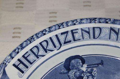 AN EXTREMELY RARE SOCIETE CERAMIQUE MAASTRICHT "HERRIJZEND NEDERLAND" LIBERATION COMMEMORATIVE PLATE