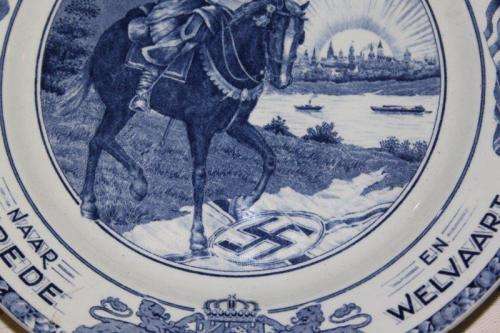 AN EXTREMELY RARE SOCIETE CERAMIQUE MAASTRICHT "HERRIJZEND NEDERLAND" LIBERATION COMMEMORATIVE PLATE