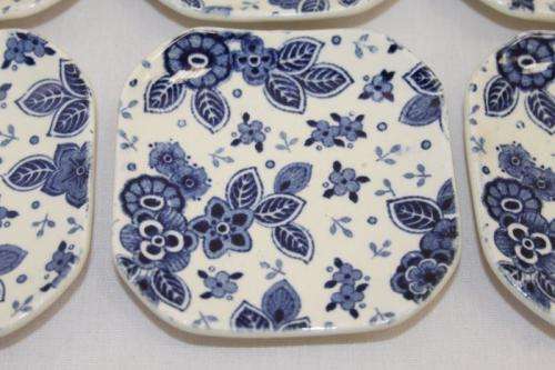 A SET OF SIX EXTREMELY RARE DUTCH MADE "SOCIETE CERAMIQUE MAASTRICHT" PORCELAIN TABLE SPOON RESTS