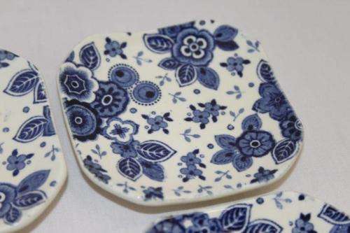 A SET OF SIX EXTREMELY RARE DUTCH MADE "SOCIETE CERAMIQUE MAASTRICHT" PORCELAIN TABLE SPOON RESTS