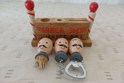 A FABULOUS VINTAGE "BARBER SHOP QUARTET" BAR ACCESSORY SET INCLUDING BOTTLE OPENER ETC
