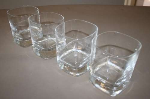 A GORGEOUS SET OF FOUR WHISKEY GLASSES WITH THICK HEAVY BASES IN GREAT CONDITION!!
