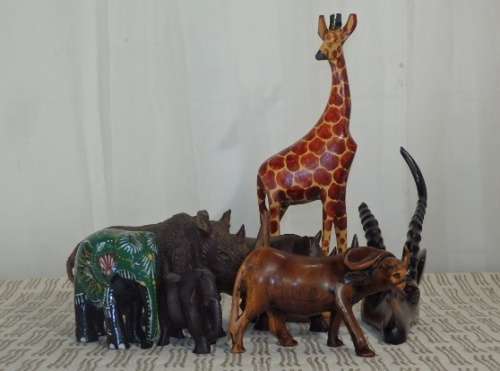 A STUNNING COLLECTION OF SIX WOODEN CARVED ANIMAL FIGURINES INCLUDING A STUNNING PAINTED ELEPHANT