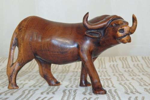 A STUNNING COLLECTION OF SIX WOODEN CARVED ANIMAL FIGURINES INCLUDING A STUNNING PAINTED ELEPHANT