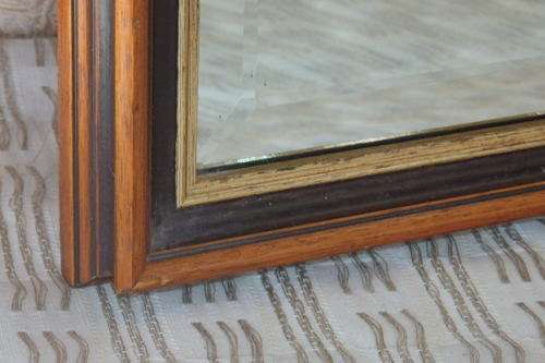 A BEAUTIFUL DARK WOODEN FRAMED BEVELED GLASS MIRROR WITH GOLD GILDING, GORGEOUS FOR ANY HOME