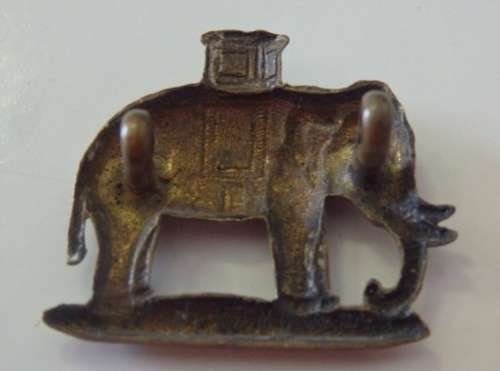 A STUNNING BRITISH "ROYAL GURKHA RIFLES" ROCK FORT (THE ELEPHANT DOG) ARM BADGE