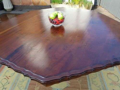 AN EXQUISITE LARGE ANTIQUE SOLID IMBUIA "OCTAGONAL" 8-SEATER (PEDESTAL) BALL AND CLAW DINING TABLE