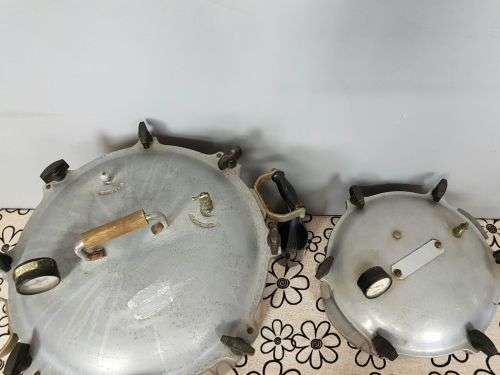 TWO INCREDIBLE ANTIQUE (LARGE) PRESSURE COOKERS WITH BAKELITE TIGHTENERS bid/cooker