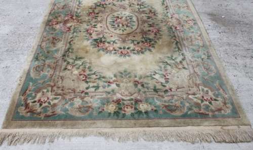 A WONDERFUL ANTIQUE PURE WOOL PILE CARPET (2.9m x 1.8m) WITH GREENS, PINKS, TANS AND EARTHY TONES