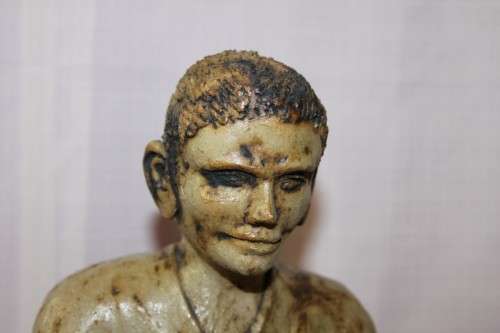 A SUPERB LARGE ONE-OF-A-KIND HAND SCULPTED STONEWARE "MAN" SCULPTURE HOLDING A GLASS BALL