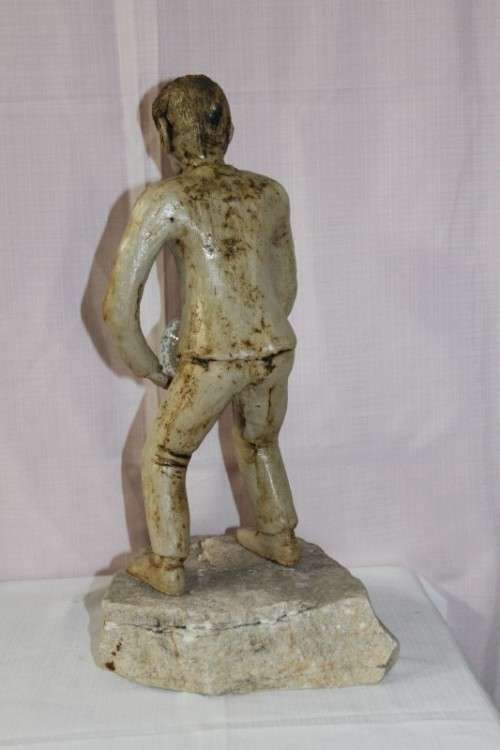 A SUPERB LARGE ONE-OF-A-KIND HAND SCULPTED STONEWARE "MAN" SCULPTURE HOLDING A GLASS BALL