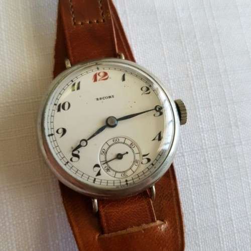 A WONDERFUL ANTIQUE (cWW1) ENGLISH MADE "ESCORT" GENTS STEEL TRENCH WATCH WITH A NEW LEATHER STRAP