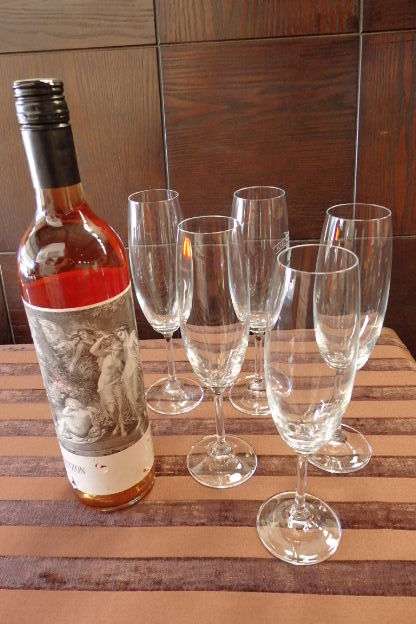 AN AWESOME COLLECTION OF EIGHT TALL FLUTED CHAMPAGNE GLASSES IN GREAT CONDITION