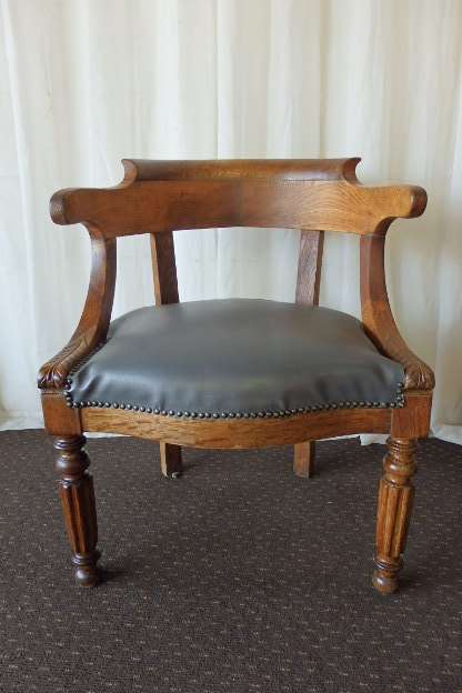 A SPECTACULAR ANTIQUE HAND CARVED SOLID OAK CAPTAINS CHAIR WITH "SHERATON" FLUTED TURNED LEGS