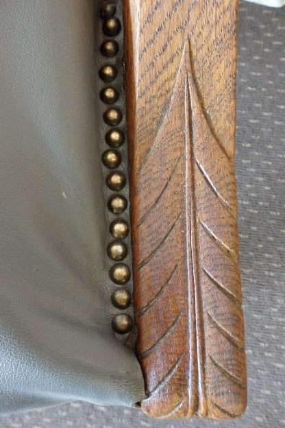 A SPECTACULAR ANTIQUE HAND CARVED SOLID OAK CAPTAINS CHAIR WITH "SHERATON" FLUTED TURNED LEGS