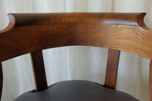 A SPECTACULAR ANTIQUE HAND CARVED SOLID OAK CAPTAINS CHAIR WITH "SHERATON" FLUTED TURNED LEGS