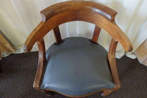 A SPECTACULAR ANTIQUE HAND CARVED SOLID OAK CAPTAINS CHAIR WITH "SHERATON" FLUTED TURNED LEGS