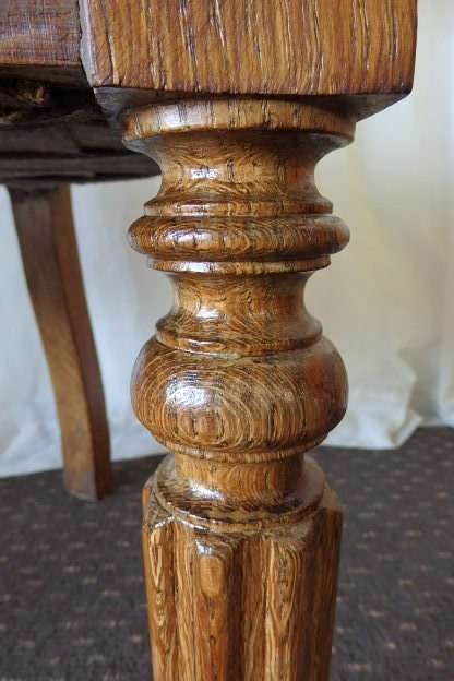 A SPECTACULAR ANTIQUE HAND CARVED SOLID OAK CAPTAINS CHAIR WITH "SHERATON" FLUTED TURNED LEGS