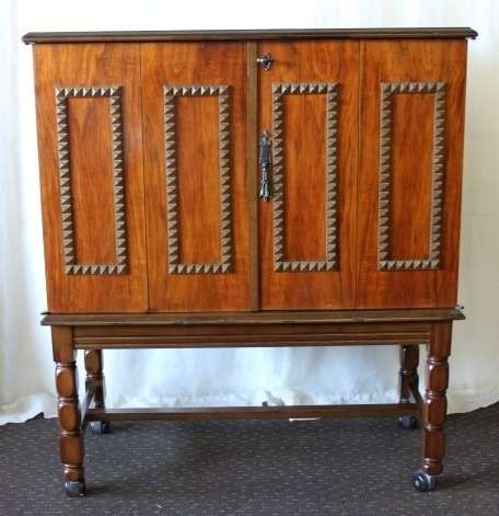 AN AMAZING RETRO (c1970's) WOODEN CABINET ON ITS ORIGINAL CASTORS WITH AWESOME RELIEF DETAILING