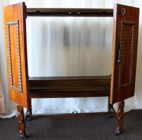AN AMAZING RETRO (c1970's) WOODEN CABINET ON ITS ORIGINAL CASTORS WITH AWESOME RELIEF DETAILING