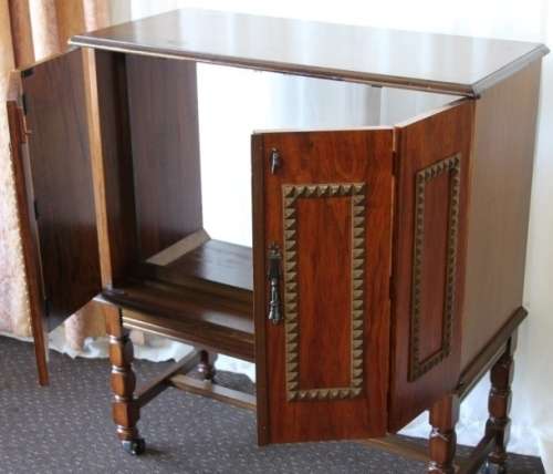 AN AMAZING RETRO (c1970's) WOODEN CABINET ON ITS ORIGINAL CASTORS WITH AWESOME RELIEF DETAILING
