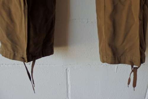 A GREAT PAIR OF GREEN/ BROWN MILITARY CARGO PANTS WITH BELT IN WONDERFUL CONDITION