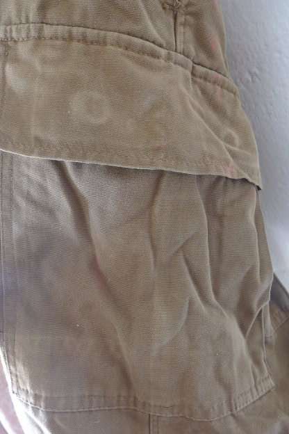 A GREAT PAIR OF GREEN/ BROWN MILITARY CARGO PANTS WITH BELT IN WONDERFUL CONDITION