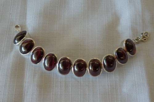 A FABULOUS BROAD CHUNKY SILVER LADIES BRACELET WITH TEN (LARGE) OVAL RED SARDONYX STONES