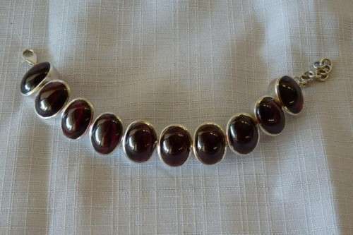 A FABULOUS BROAD CHUNKY SILVER LADIES BRACELET WITH TEN (LARGE) OVAL RED SARDONYX STONES