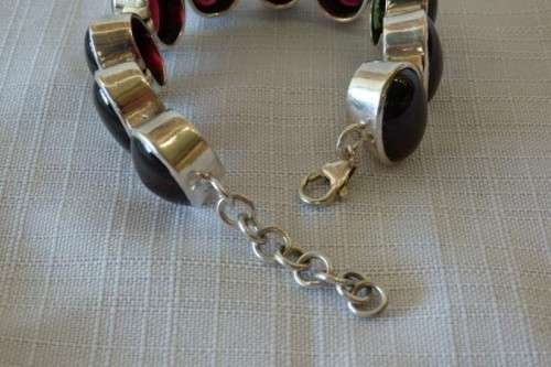 A FABULOUS BROAD CHUNKY SILVER LADIES BRACELET WITH TEN (LARGE) OVAL RED SARDONYX STONES