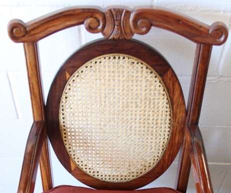 Two beautiful solid Stink Wood Ball & Claw occasional arm chairs with wicker backrests!!! bid/chair