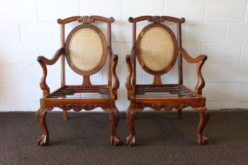 Two beautiful solid Stink Wood Ball & Claw occasional arm chairs with wicker backrests!!! bid/chair