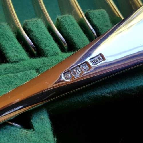 A spectacular antique Hallmarked sterling silver Walker & Hall boxed 12 place setting cutlery set