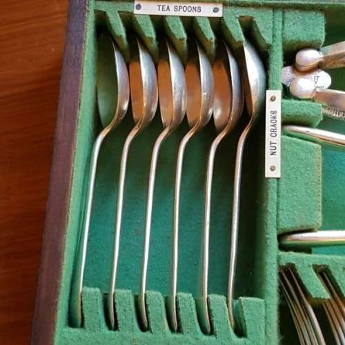 A spectacular antique Hallmarked sterling silver Walker & Hall boxed 12 place setting cutlery set