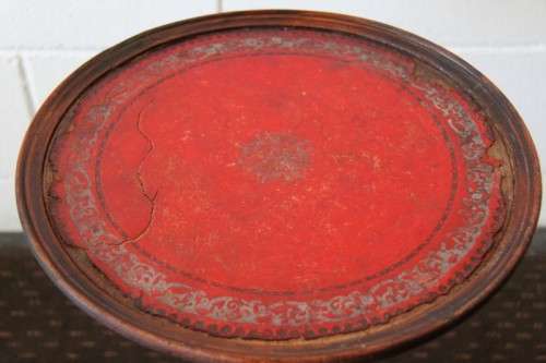 A stunning Victorian antique mahogany occasional table w/ a leather clad top and scalloped rim