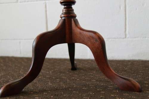 A stunning Victorian antique mahogany occasional table w/ a leather clad top and scalloped rim