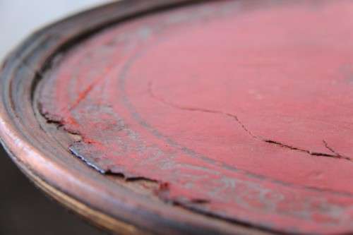 A stunning Victorian antique mahogany occasional table w/ a leather clad top and scalloped rim