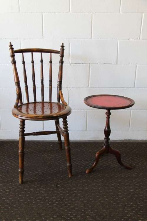 A stunning Victorian antique mahogany occasional table w/ a leather clad top and scalloped rim