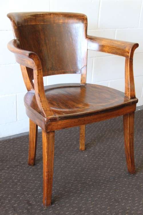 A gorgeous Edwardian antique oak fire house captain's chair with beautiful carved arm rests