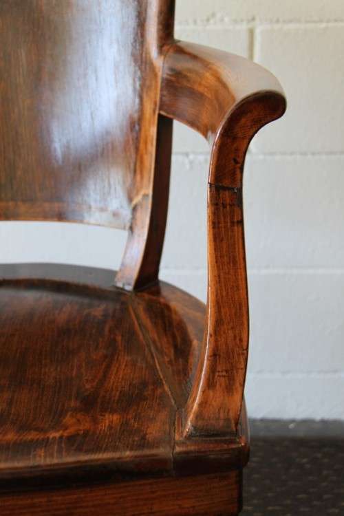 A gorgeous Edwardian antique oak fire house captain's chair with beautiful carved arm rests